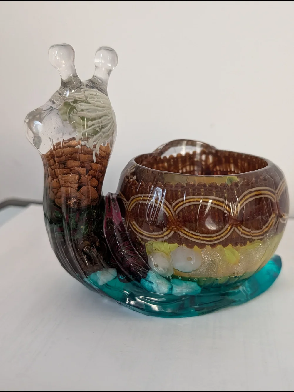A unique vase in the form of a snail. Handmade.